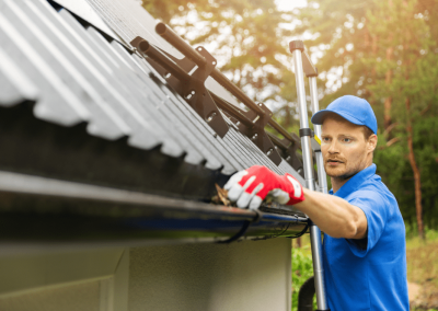 cleaning leaves from gutter